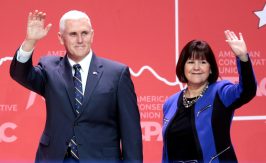 image of Mike Pence and his wife waving at a crowd